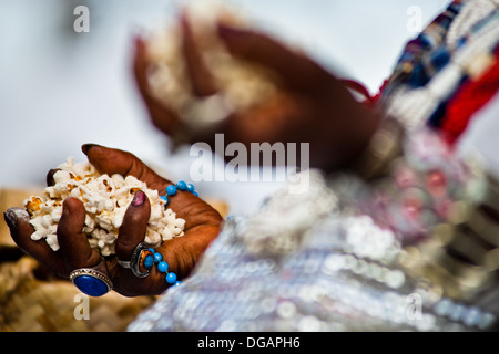 Hands of a Baiana woman seen during the Afro-Brazilian spiritual cleansing ritual performed in Salvador, Bahia, Brazil. Stock Photo