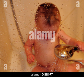A baby boy in a shower Stock Photo