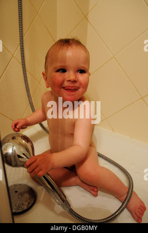 A baby boy in a shower Stock Photo