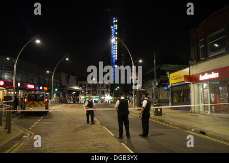 London, UK. 17th October 2013. Police presence outside Iford Station is cordorned off to carry out investigations into the stabbing of a man believed to be in his late 20s. Credit: Elsie Kibue / Alamy Live News Stock Photo
