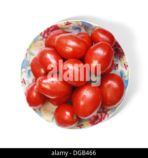 Fresh cherry tomatoes on plate. Isolated on white background Stock Photo
