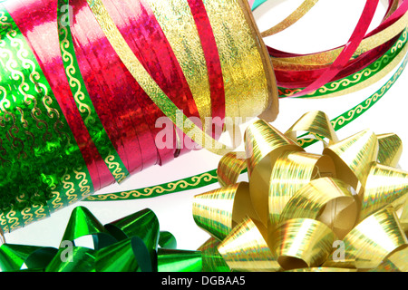 Green, gold and red ribbons and bows in closeup Stock Photo