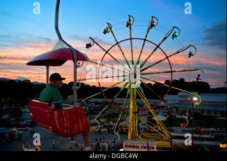 A carnival ride / Farris Wheel in action at the Mountain State Fair in Asheville, North Carolina Stock Photo