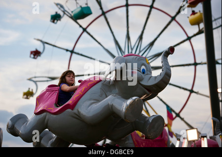 A girl enjoying an elephant ride at the Mountain State Fair in Asheville, North Carolina Stock Photo