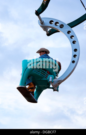 A cowboy on Ferris Wheel ride at the North Carolina Mountain State Fair Stock Photo