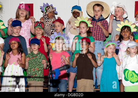Students age 8 Muslim, Black and white singing in Spring Garden Musical. Horace Mann Elementary School St Paul Minnesota MN USA Stock Photo