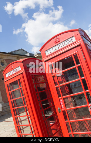 Two old-fashioned red telephone boxes (part of a group of four) outside the Market Place shopping centre, Bolton. (No longer there). Stock Photo