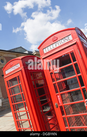 Two old-fashioned red telephone boxes (part of a group of four) outside the Market Place shopping centre, Bolton. (No longer there). Stock Photo