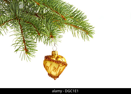 Christmas decoration. Yellow Christmas toy on fir tree Stock Photo