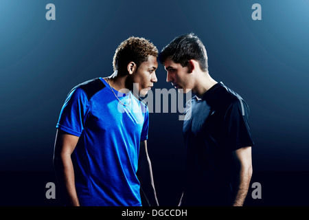 Portrait of two male soccer players head to head Stock Photo