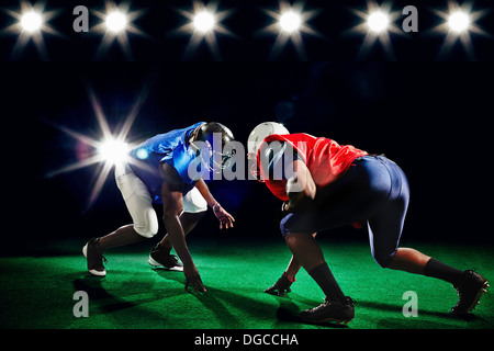 Two american footballers playing head to head Stock Photo