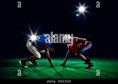 Two american footballers crouching Stock Photo