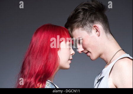 Young couple head to head in studio Stock Photo
