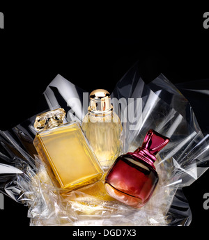 Generic perfume bottles in a gift set on black background Stock Photo