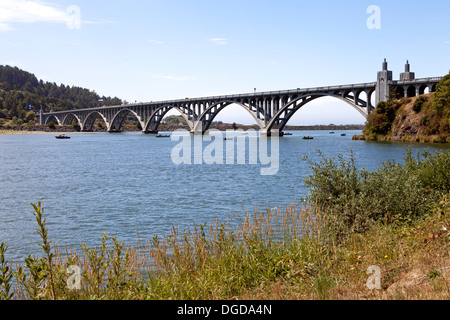 The 1898 foot long Isaac Lee Patterson bridge crosses the Rogue River near Gold Beach, Oregon. Stock Photo