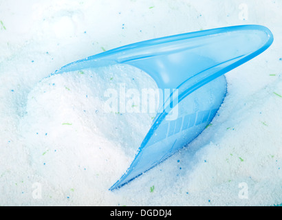 Blue cup or scoop of white powder Detergent for clothes washing Stock Photo  - Alamy