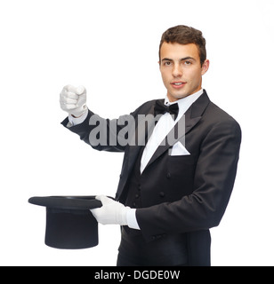 magician in top hat showing trick Stock Photo