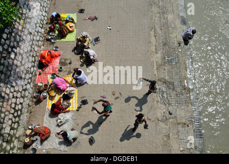 Hindu pilgrims on the bank of Ganges River in Haridwar Stock Photo