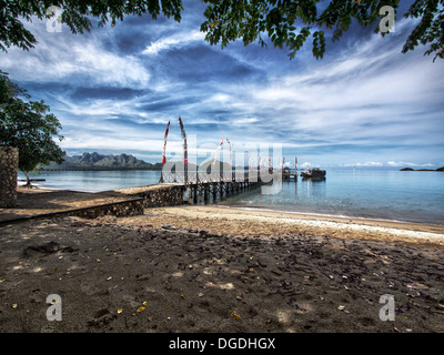 The main pier on Komodo Island, natural habitat of the Komodo Dragon in East Nusa Tenggara, Indonesia. Stock Photo
