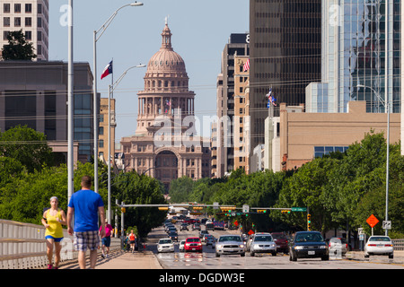 Traffic and people cross S Congress Avenue bridge with Austin skyline in background Texas USA Stock Photo
