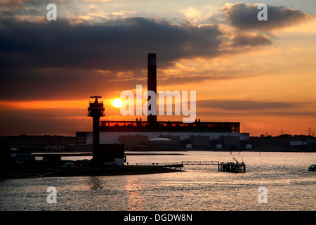 NCI Calshot Tower Lookout Station at sunset, WITH FAWLEY POWER STATION BEHIND Stock Photo