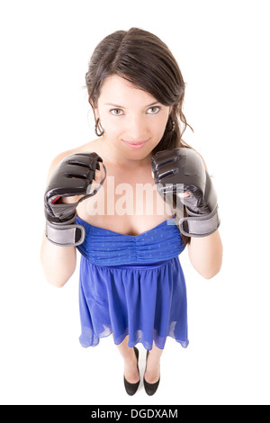 Young woman wearing boxing gloves in casual dress Stock Photo