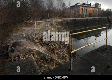 Disused docklands with overgrown slipway at Princes Docks, Govan, Glasgow, Scotland, UK, Great Britain Stock Photo