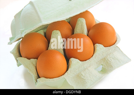 six eggs in a paper container group isolated Stock Photo