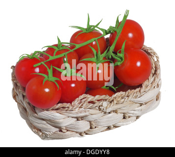 Green tomatoes in basket isolated on white Stock Photo - Alamy