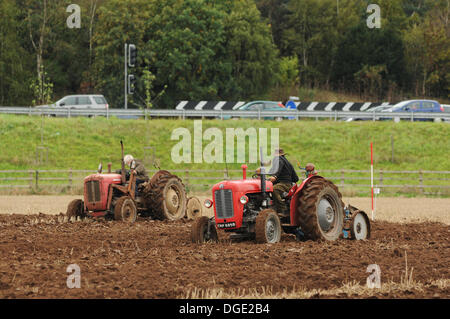 Warwick, Warwickshire, UK. Saturday 19th October 2013. The Warwick Vintage Tractor and Machinery Society held their annual plouging competition in a field on the outskirts of Warwick. The competitiors all used vintage tractors, and were judged on the straightness of their furrows and the quality of the soil. Credit:  Jamie Gray/Alamy Live News Stock Photo