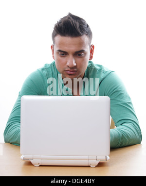 young man using laptop computer Stock Photo