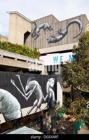 Murals by Phlegm in the foreground & Roa in the background, Queen Elizabeth Hall, Southbank, London. Stock Photo