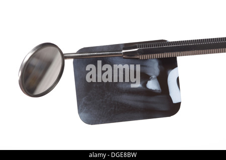 x-ray of tooth film detail and dental instrument isolated on white Stock Photo