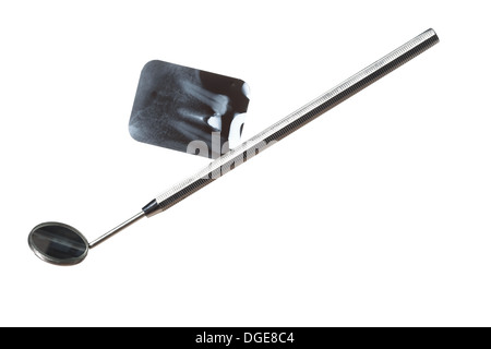 x-ray of tooth film detail and dental instrument isolated on white Stock Photo