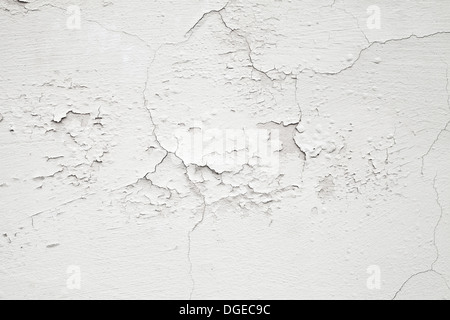 Closeup white concrete wall texture with cracked plaster Stock Photo