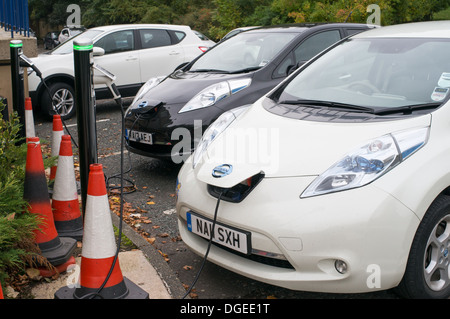 Two Nissan Leaf electric cars being charged Durham, north east England, UK Stock Photo