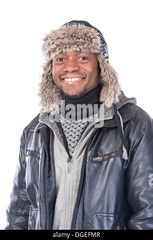 Young African-American wearing winter clothing but feeling cold in a white background Stock Photo