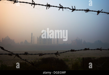 View of the Taj Mahal from the riverside, trough barbed wire Stock Photo