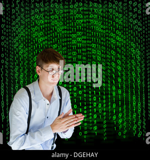 Businessman or teacher with binary on blackboard background Stock Photo