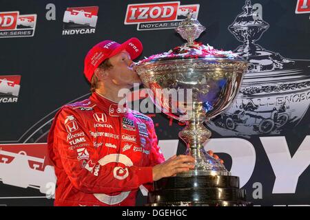 Fontana, California, USA. 19th Oct, 2013. Indycar Champion SCOTT DIXON of New Zealand driver of the #9 Target Chip Ganassi Racing Dallara Honda kisses the Championship Trophy after winning the IZOD IndyCar Series MAVTV 500 World Championship at the Auto Club Speedway on Saturday in Fontana, California. © Ron Bijlsma/ZUMAPRESS.com/Alamy Live News Stock Photo