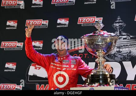 Fontana, California, USA. 19th Oct, 2013. Indycar Champion SCOTT DIXON of New Zealand driver of the #9 Target Chip Ganassi Racing Dallara Honda celebrates his third title victory with the Championship Trophy after winning the IZOD IndyCar Series MAVTV 500 World Championship at the Auto Club Speedway on Saturday in Fontana, California. © Ron Bijlsma/ZUMAPRESS.com/Alamy Live News Stock Photo