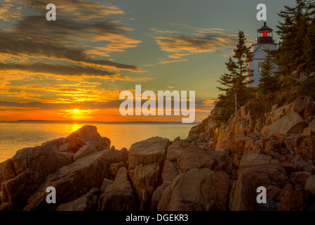 Bass Harbor Head Light overlooks the entrance to Bass Harbor and Blue Hill Bay just before sunset in Acadia National Park. Stock Photo