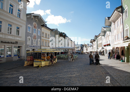 Cobbled stoned Marktstrasse flanked by statuesque town houses in Bad Tolz. A pretty spar town straddling the Isar River Bavaria Stock Photo