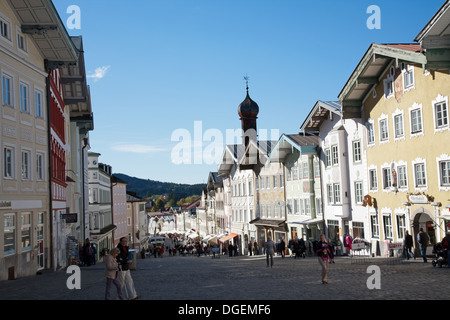 Cobbled stoned Marktstrasse flanked by statuesque town houses in Bad Tolz. A pretty spar town straddling the Isar River Bavaria Stock Photo
