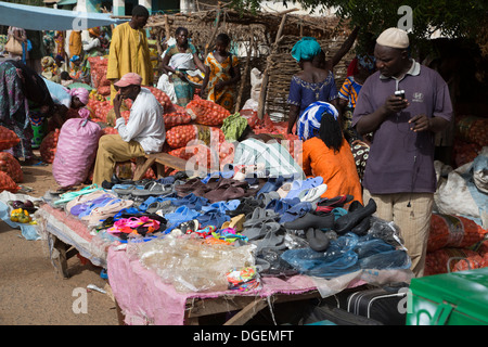 Weekly Market at Fass Njaga Choi, North Bank Region, The Gambia. Flipflops, Shoes, Onions for Sale. Stock Photo