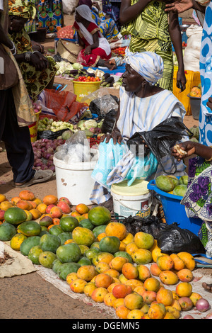 Weekly Market at Fass Njaga Choi, North Bank Region, The Gambia. Woman Selling Mangoes. Stock Photo