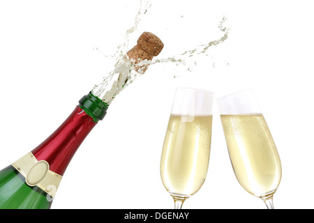 Champagne splashing out of the bottle with a popping cork Stock Photo