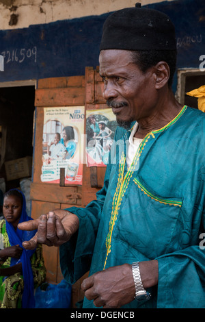 Man Talking at the Weekly Market at Fass Njaga Choi, North Bank Region, The Gambia. Stock Photo