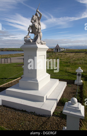 Islands of Orkney, Scotland. The St George slaying the Dragon sculpture, with the Italian Chapel in the background. Stock Photo