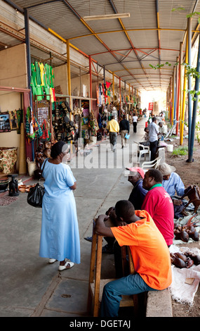 Street scene with local people, craft and curio shops, Livingstone town centre, Zambia Africa Stock Photo